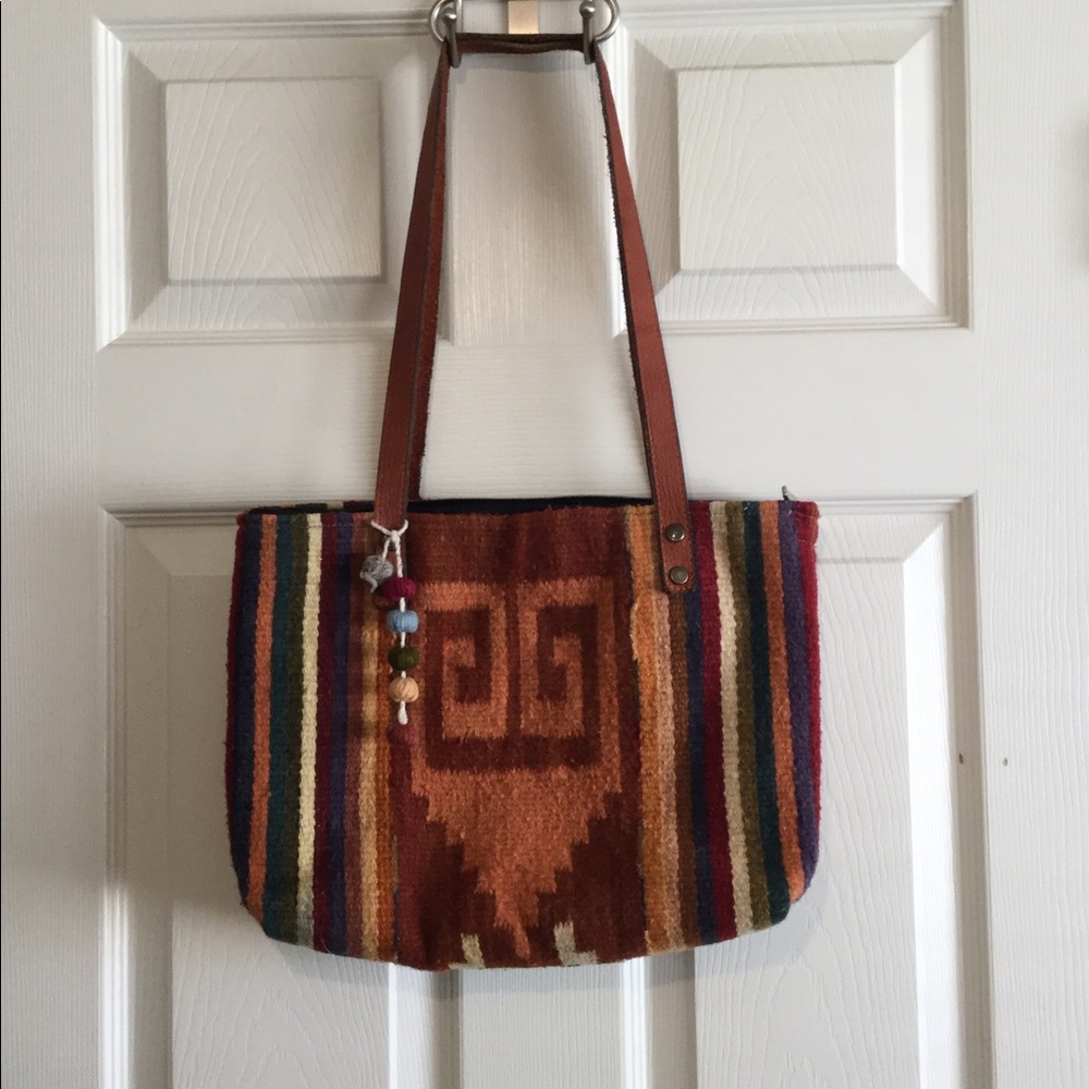 The Zapotec Weavers Oaxaca Wool Tote with Aztec design and matching Pom